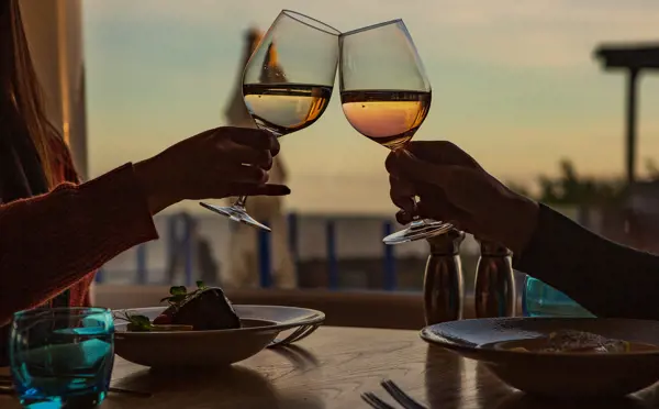 Toasting glasses over dinner